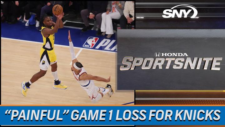Player jumps for basketball.