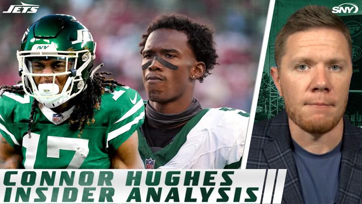 Jets' Garrett Wilson and Davante Adams with Connor Hughes discussing roles in Sunday's game.