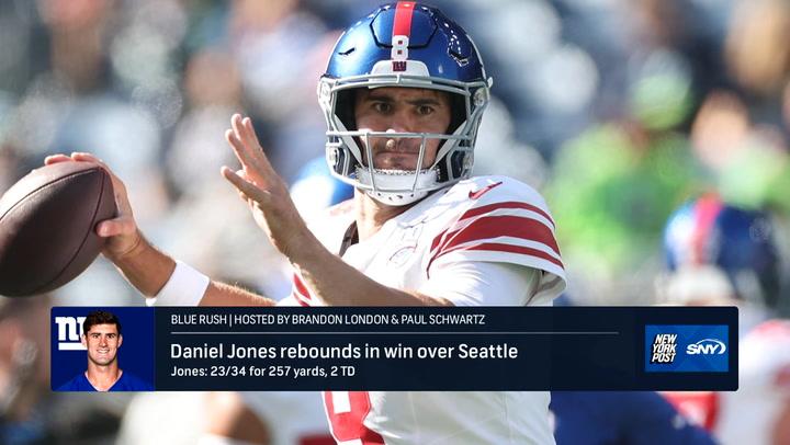 Quarterback throws a pass in Giants' Week 5 win. Blue Rush podcast recaps the victory.