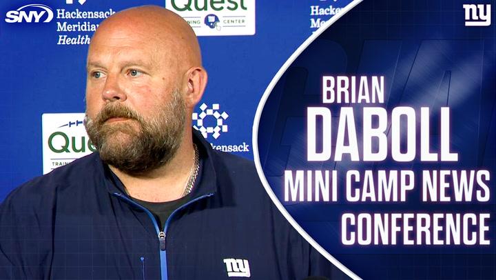 Coach at press conference.