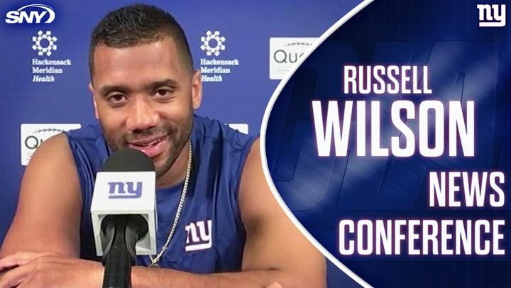 Russell Wilson at a news conference, praising Giants' defense as one of NFL's best.