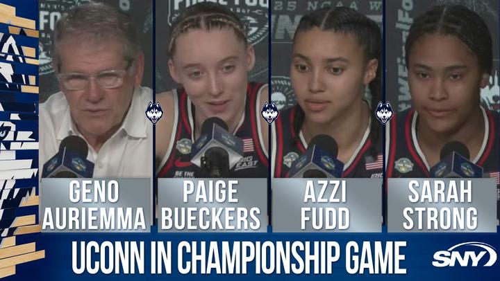 Geno Auriemma, Paige Bueckers, Azzi Fudd, and Sarah Strong celebrate UConn's win over UCLA.