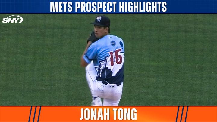 Pitcher in mid-throw stance.