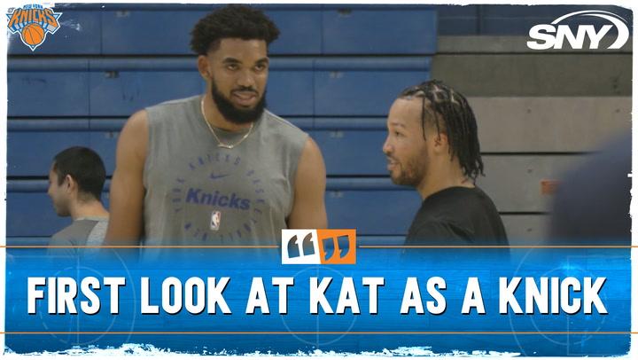 Karl-Anthony Towns at Knicks practice, chatting with a teammate on his first full day post-trade.