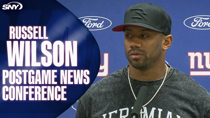 Football player at press event.