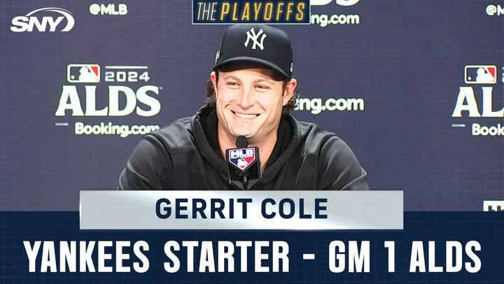 Gerrit Cole, smiling at a press conference, discusses starting Game 1 of ALDS against Royals.