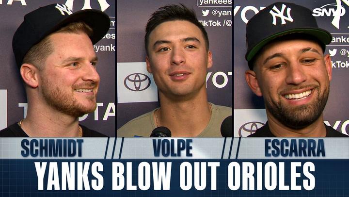 Three Yankees players smiling.
