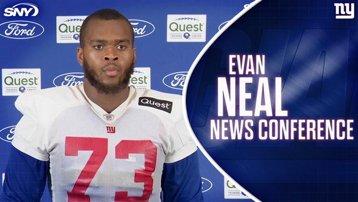 Evan Neal during a news conference after returning to Giants practice, ready to tackle any role.