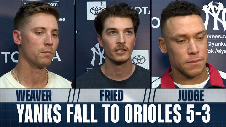 Three men discuss Yankees loss.