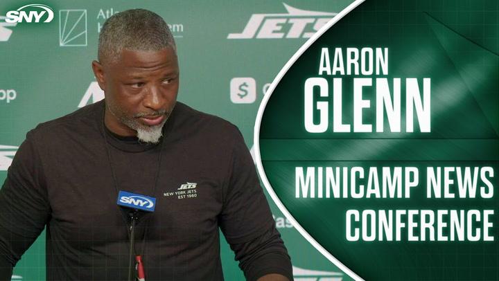"Aaron Glenn at news conference."