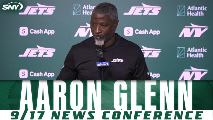 Man at Jets press conference.