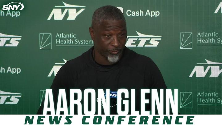 Man at Jets news conference.