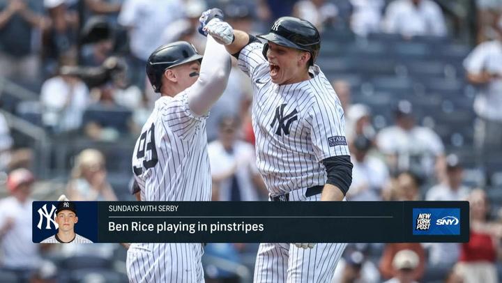 Two Yankees celebrating play.