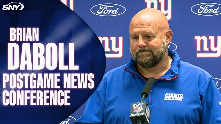 Coach at press conference.