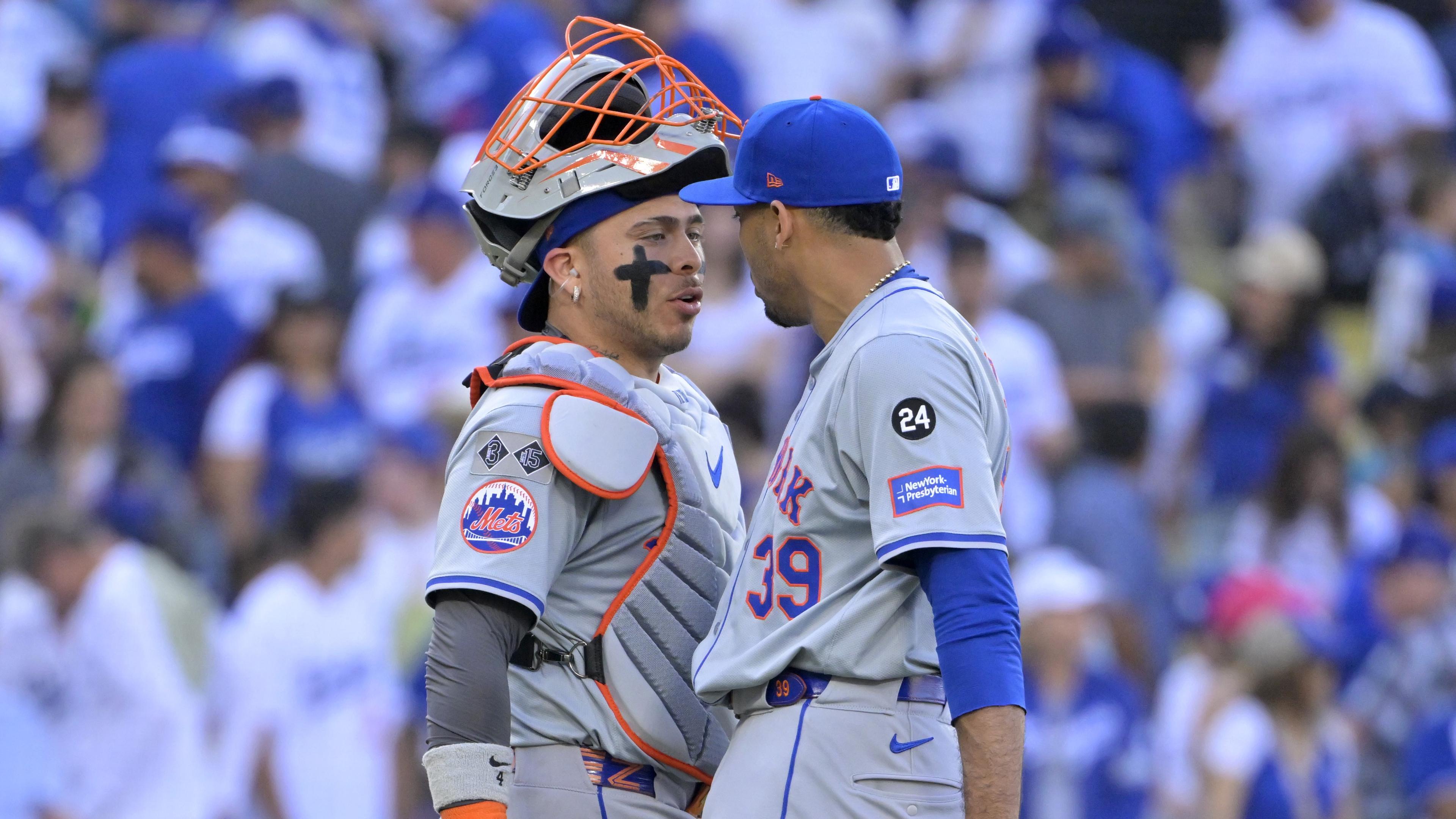 Oct 14, 2024; Los Angeles, California, USA; New York Mets pitcher Edwin Diaz (39) celebrates with catcher Francisco Alvarez (4) after defeating the Los Angeles Dodgers in game two of the NLCS for the 2024 MLB Playoffs at Dodger Stadium.