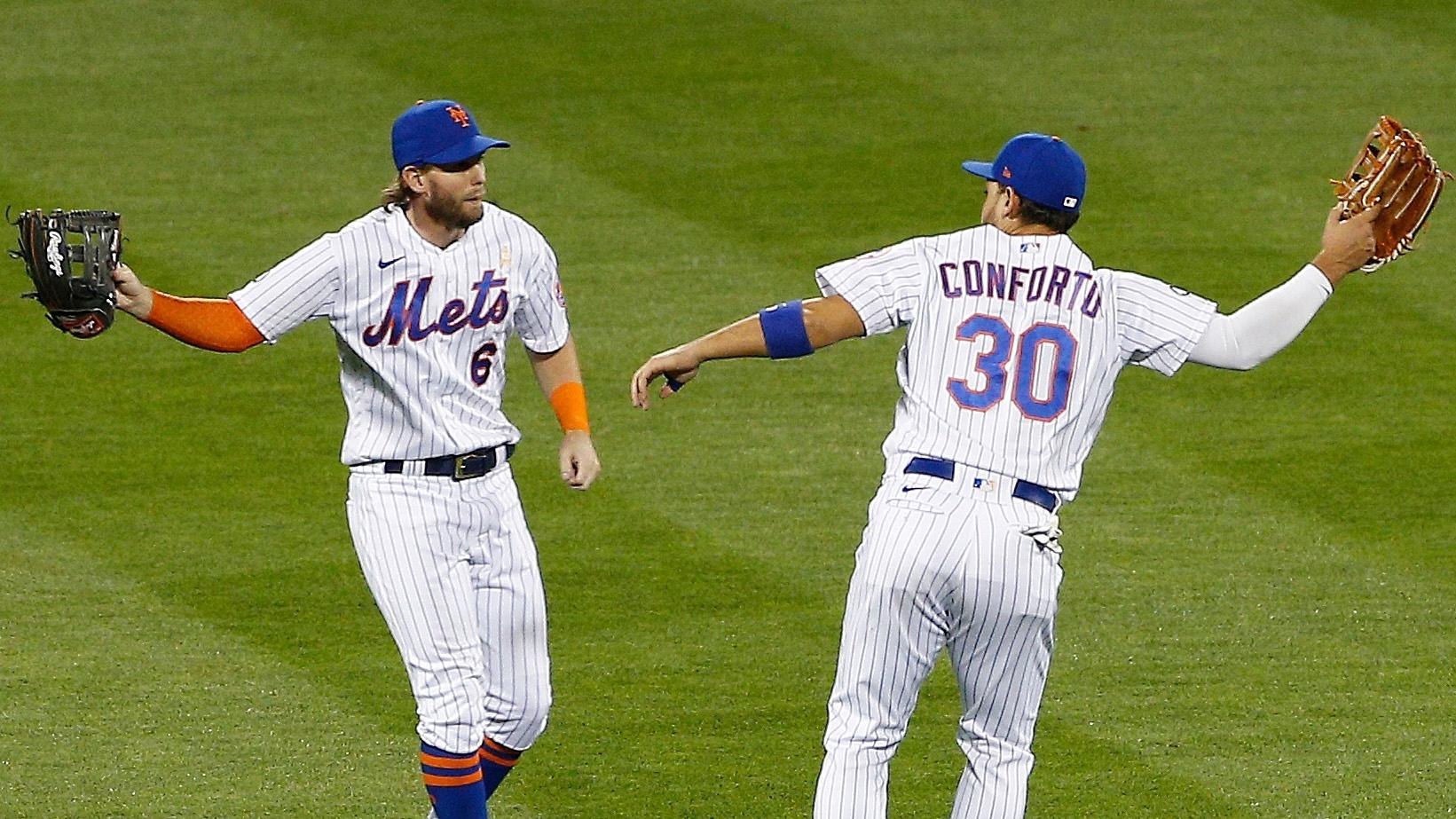 Sep 5, 2020; New York City, New York, USA; New York Mets left fielder Jeff McNeil (6) and right fielder Michael Conforto (30) react after defeating the Philadelphia Phillies at Citi Field.