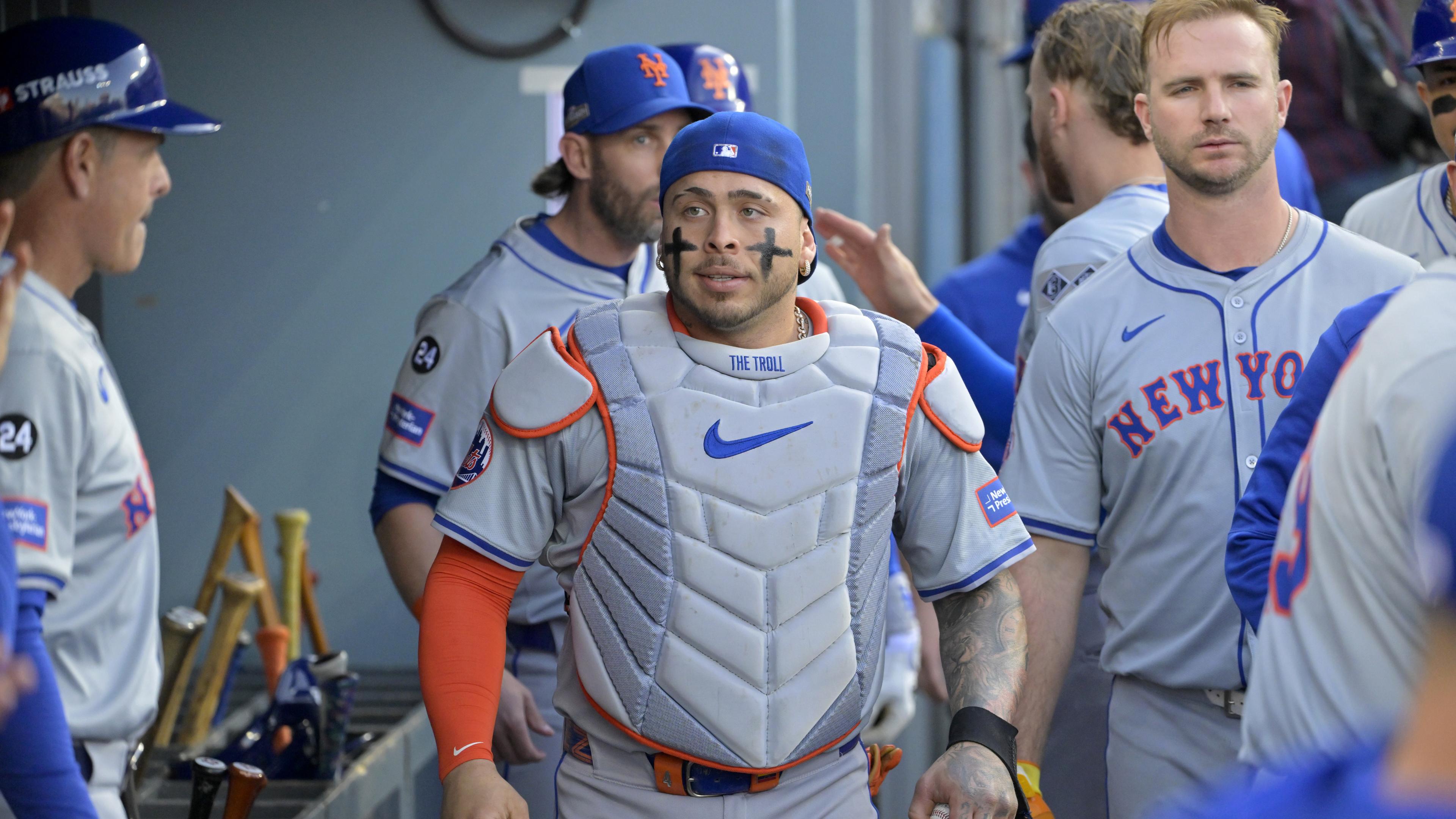 Oct 20, 2024; Los Angeles, California, USA; New York Mets catcher Francisco Alvarez (4) looks on in the dugout before game six against the Los Angeles Dodgers in the NLCS for the 2024 MLB playoffs at Dodger Stadium. Mandatory Credit: Jayne Kamin-Oncea-Imagn Images