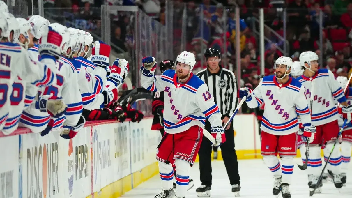 New York Rangers left wing Alexis Lafreniere (13) celebrates his goal against the Carolina Hurricanes during the third period in game three of the second round of the 2024 Stanley Cup Playoffs at PNC Arena. / James Guillory-USA TODAY Sports