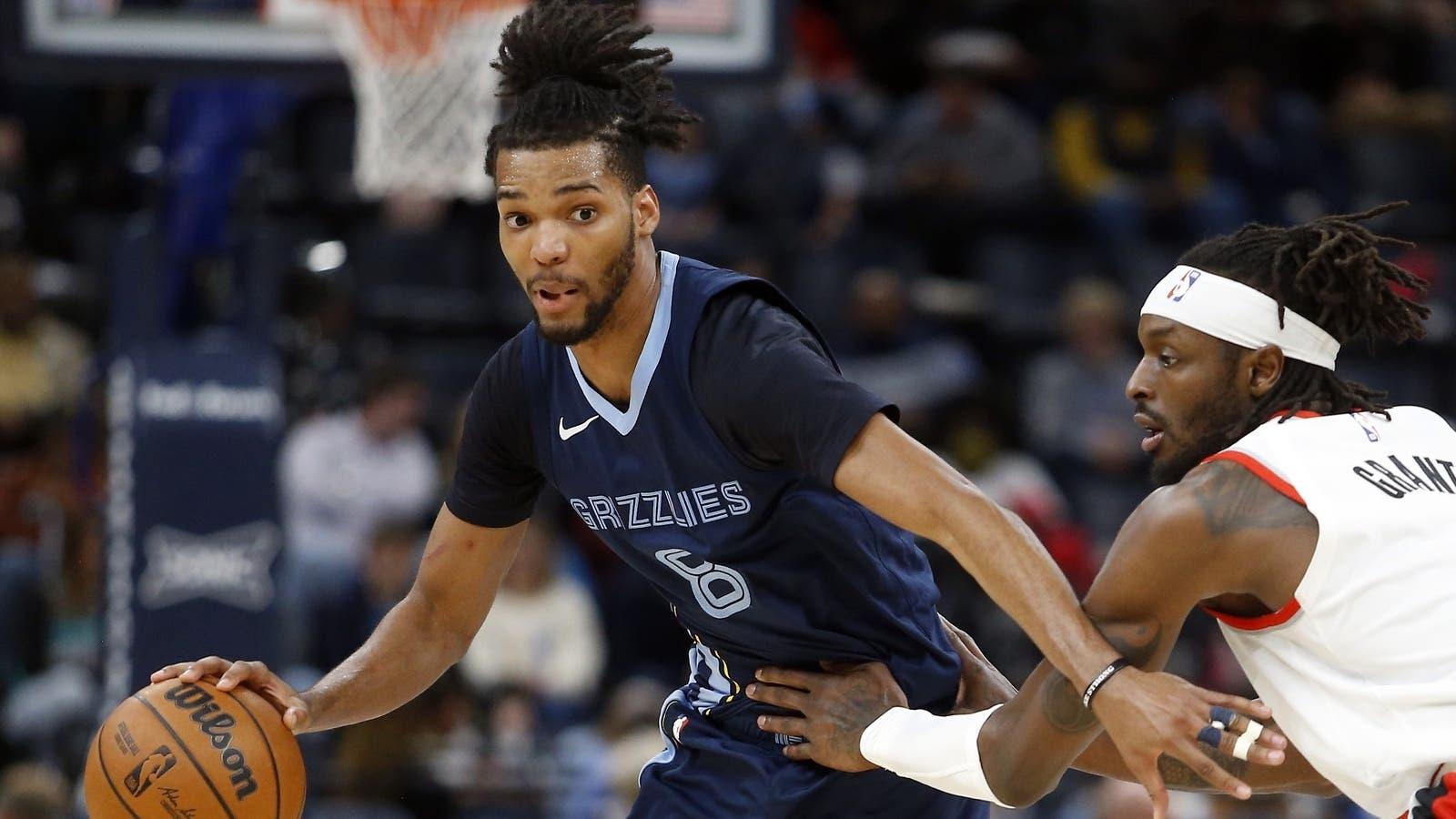 Memphis Grizzlies forward Ziaire Williams (8) dribbles around Portland Trail Blazers forward Jerami Grant (9) during the second half at FedExForum. / Petre Thomas-USA TODAY Sports