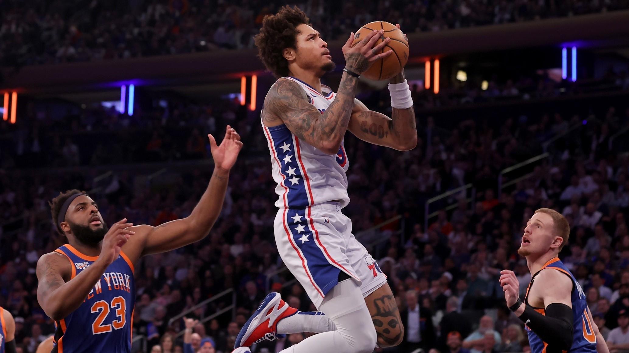 Philadelphia 76ers guard Kelly Oubre Jr. (9) drives to the basket against New York Knicks center Mitchell Robinson (23) and guard Donte DiVincenzo (0) during the second quarter of game 5 of the first round of the 2024 NBA playoffs at Madison Square Garden.