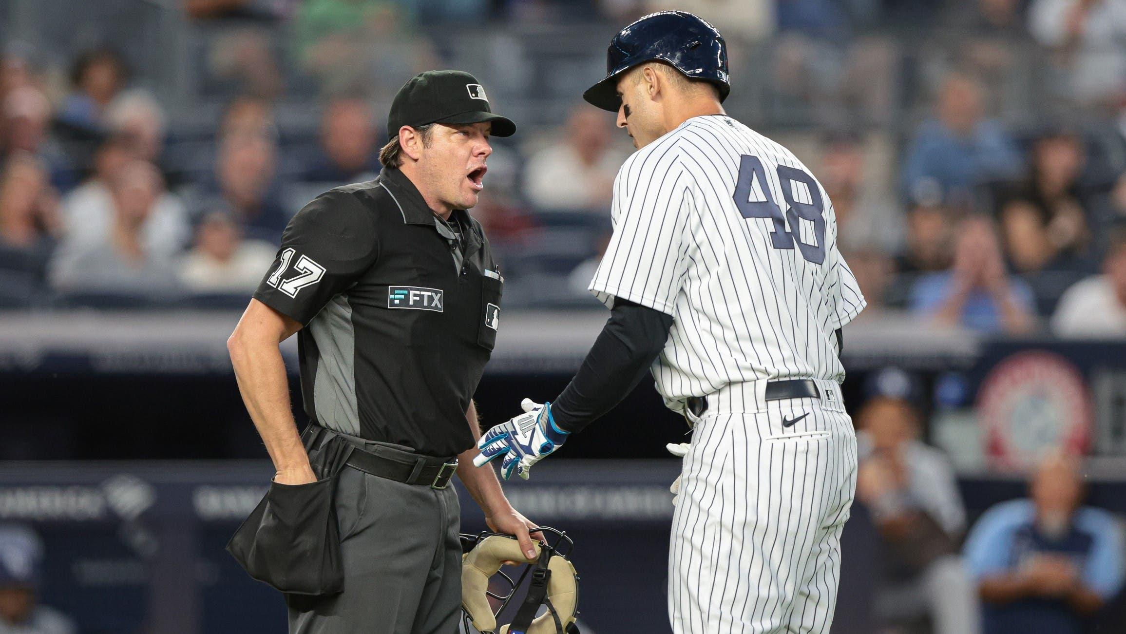 Aug 15, 2022; Bronx, New York, USA; New York Yankees first baseman Anthony Rizzo (48) talks with umpire DJ Reyburn (17) during the third inning against the Tampa Bay Rays at Yankee Stadium / Vincent Carchietta-USA TODAY Sports