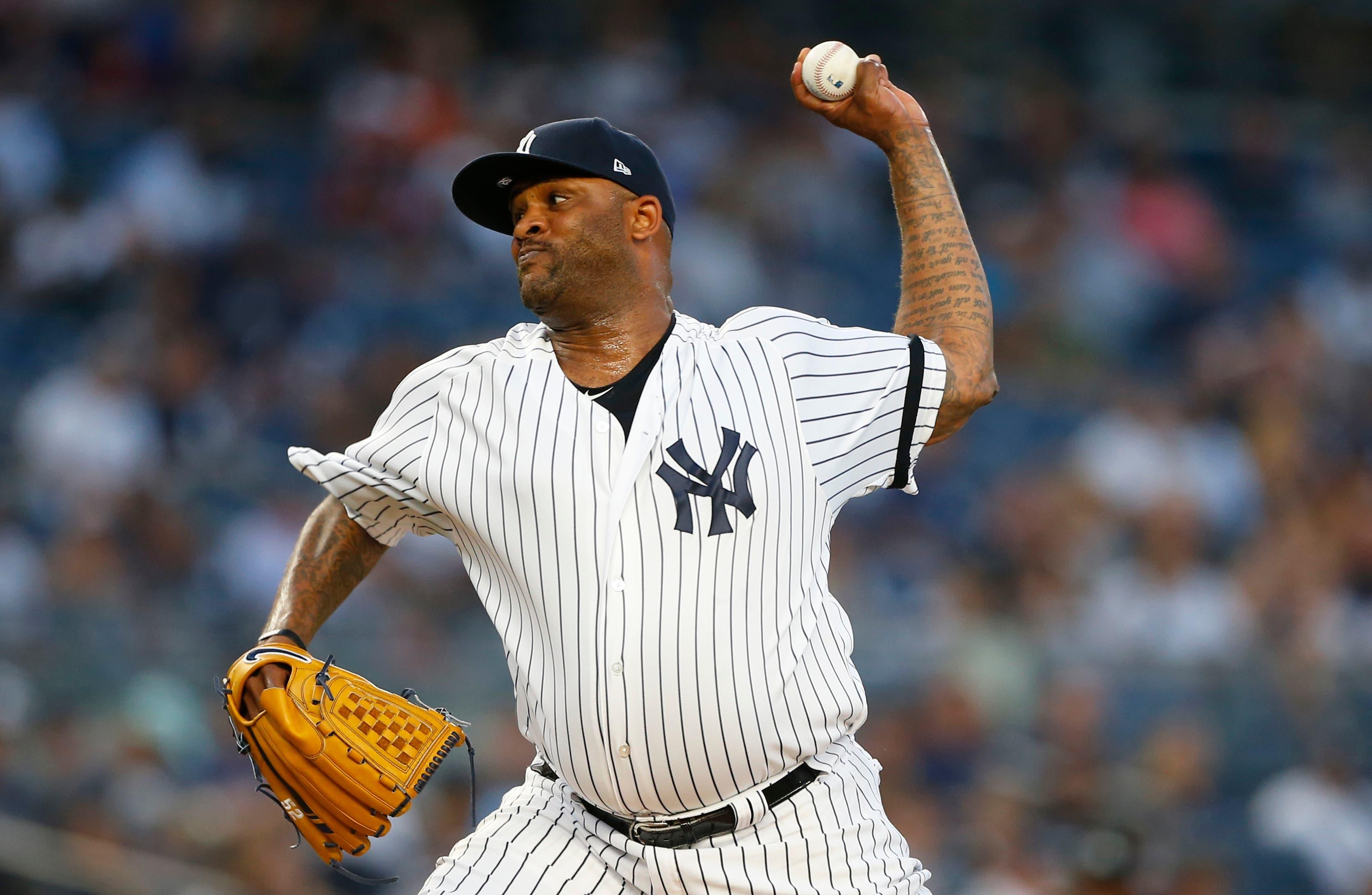 Aug 30, 2019; Bronx, NY, USA; New York Yankees starting pitcher CC Sabathia (52) pitches against the Oakland Athletics in the first inning at Yankee Stadium. Mandatory Credit: Noah K. Murray-USA TODAY Sports / Noah K. Murray