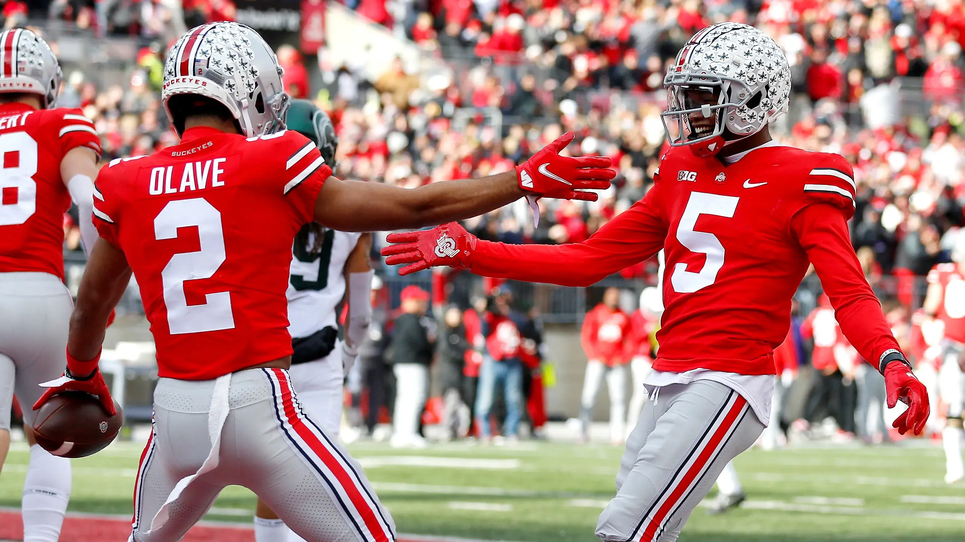 Nov 20, 2021; Columbus, Ohio, USA; Ohio State Buckeyes wide receiver Garrett Wilson (5) and wide receiver Chris Olave (2) celebrate the touchdown during the second quarter against the Michigan State Spartans at Ohio Stadium. Mandatory Credit: Joseph Maiorana-USA TODAY Sports / Joseph Maiorana-USA TODAY Sports