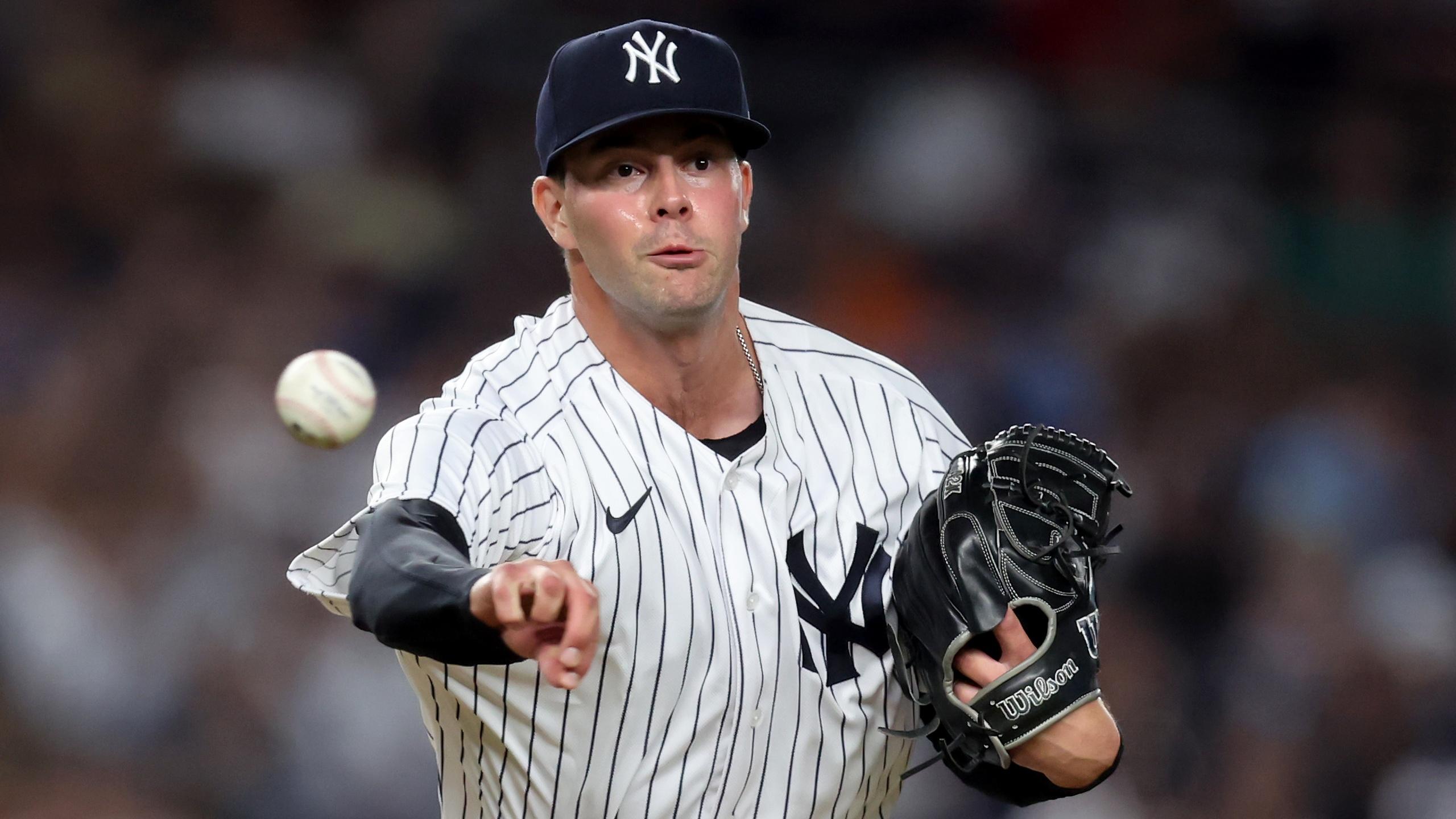 Aug 2, 2022; Bronx, New York, USA; New York Yankees relief pitcher Scott Effross (59) attempts a pickoff throw to first base against the Seattle Mariners during the seventh inning at Yankee Stadium. Mandatory Credit: Brad Penner-USA TODAY Sports