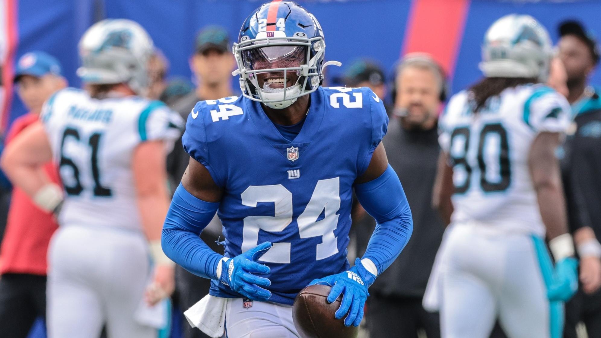 Oct 24, 2021; East Rutherford, New Jersey, USA; New York Giants cornerback James Bradberry (24) reacts after an interception against the Carolina Panthers during the first half at MetLife Stadium.