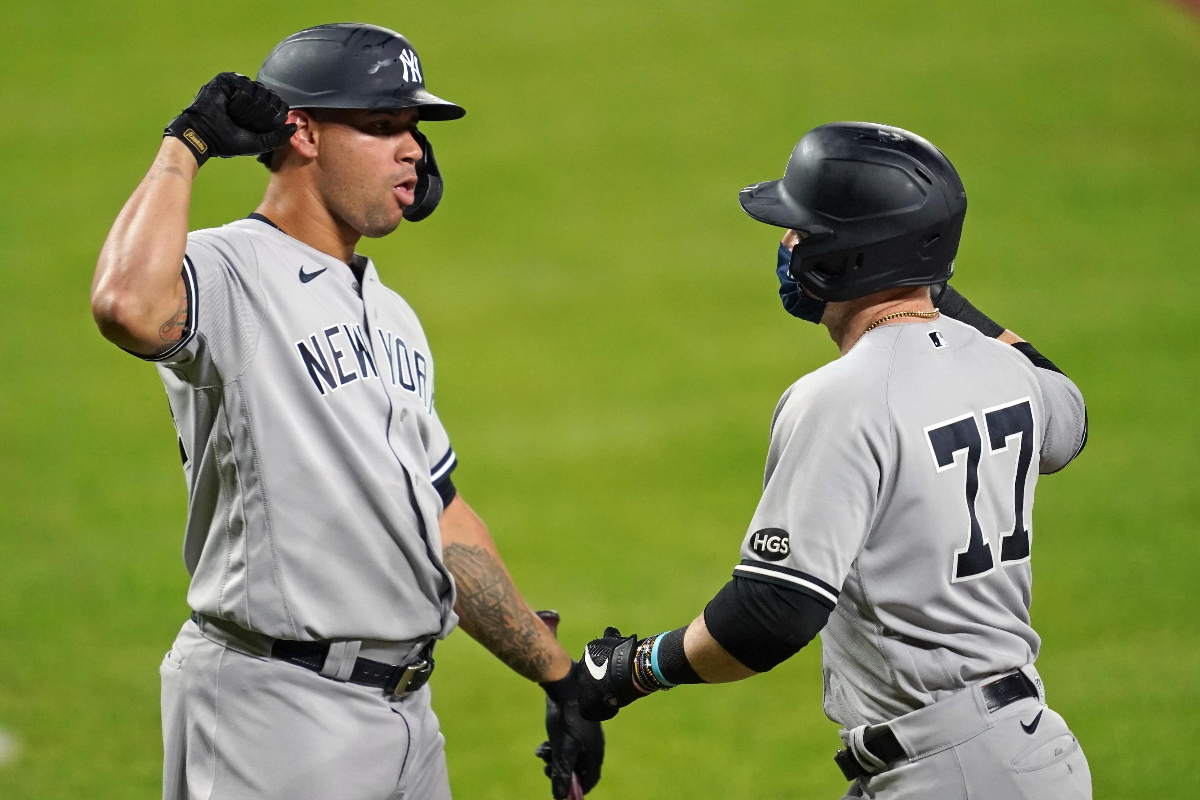 Sep 5, 2020; Baltimore, Maryland, USA; New York Yankees first baseman Clint Frazier (77) greeted by designated hitter Gary Sanchez (24) after his solo home run in the eighth inning against the Baltimore Orioles at Oriole Park at Camden Yards.