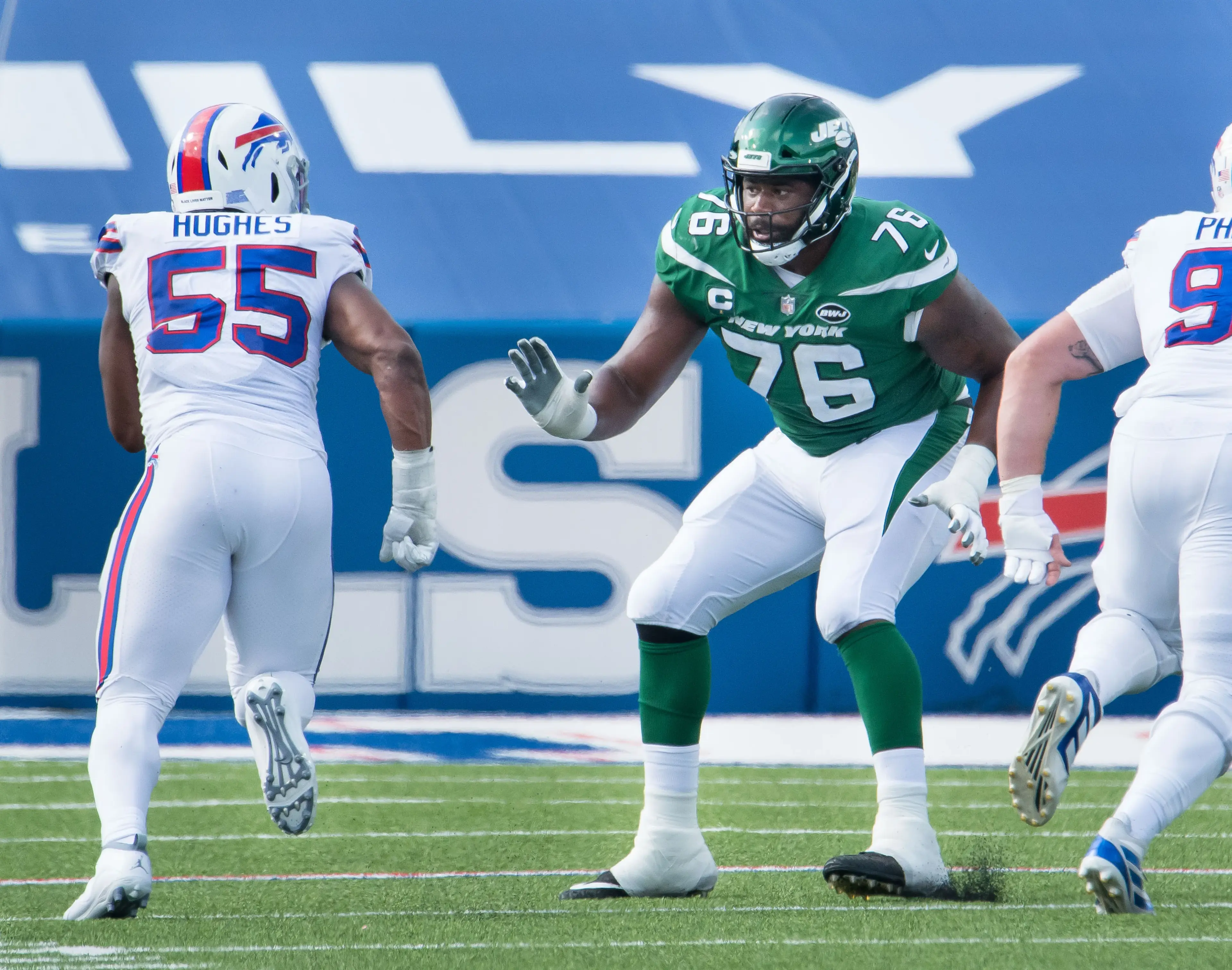 Sep 13, 2020; Orchard Park, New York, USA; New York Jets offensive tackle George Fant (76) prepares to block Buffalo Bills defensive end Jerry Hughes (55) in the fourth quarter at Bills Stadium. Mandatory Credit: Mark Konezny-USA TODAY Sports / © Mark Konezny-USA TODAY Sports