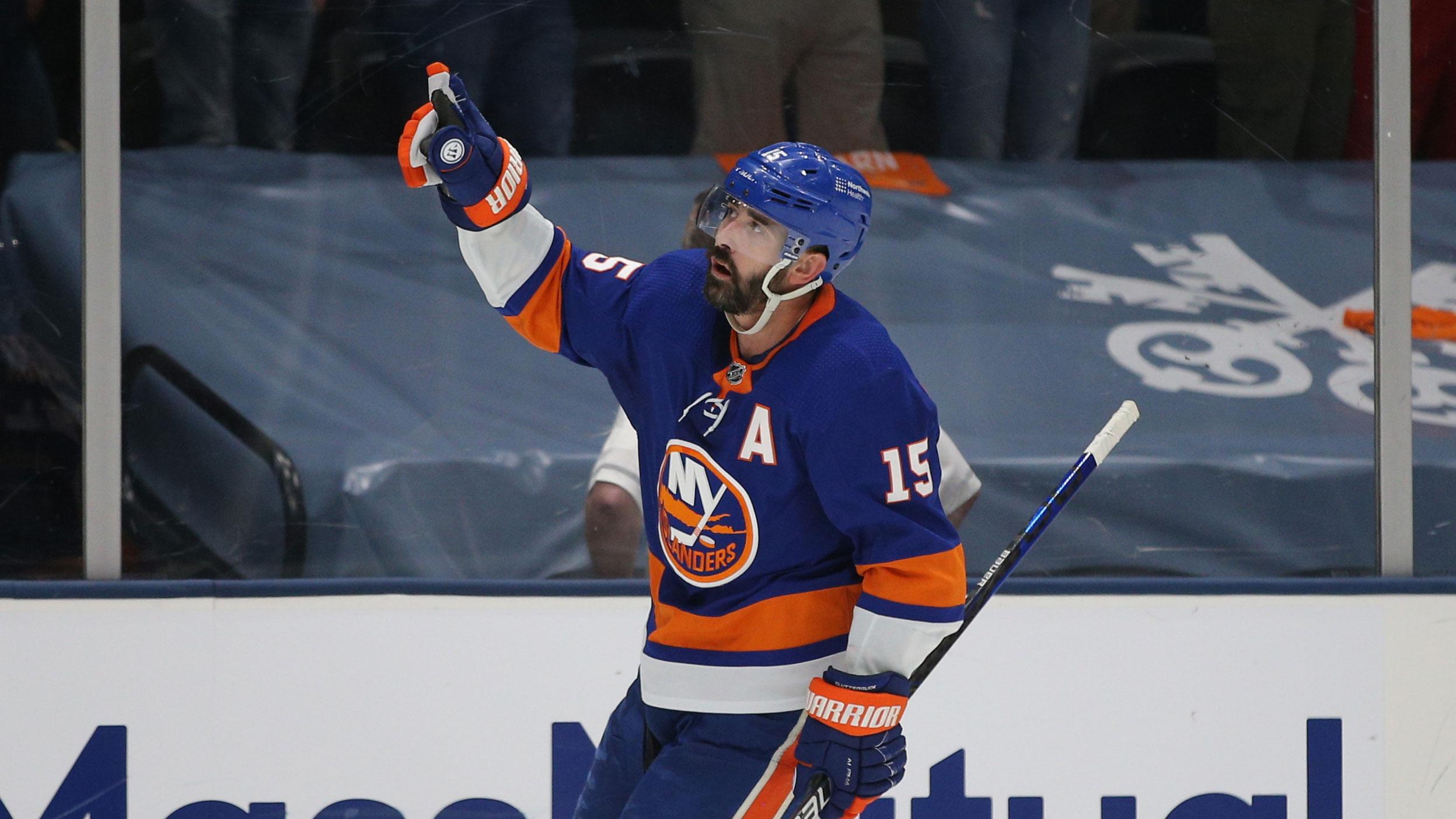 Jun 9, 2021; Uniondale, New York, USA; New York Islanders right wing Cal Clutterbuck (15) points to the fans after his empty net goal against the Boston Bruins during the third period of game six of the third round of the 2021 Stanley Cup Playoffs at Nassau Veterans Memorial Coliseum.