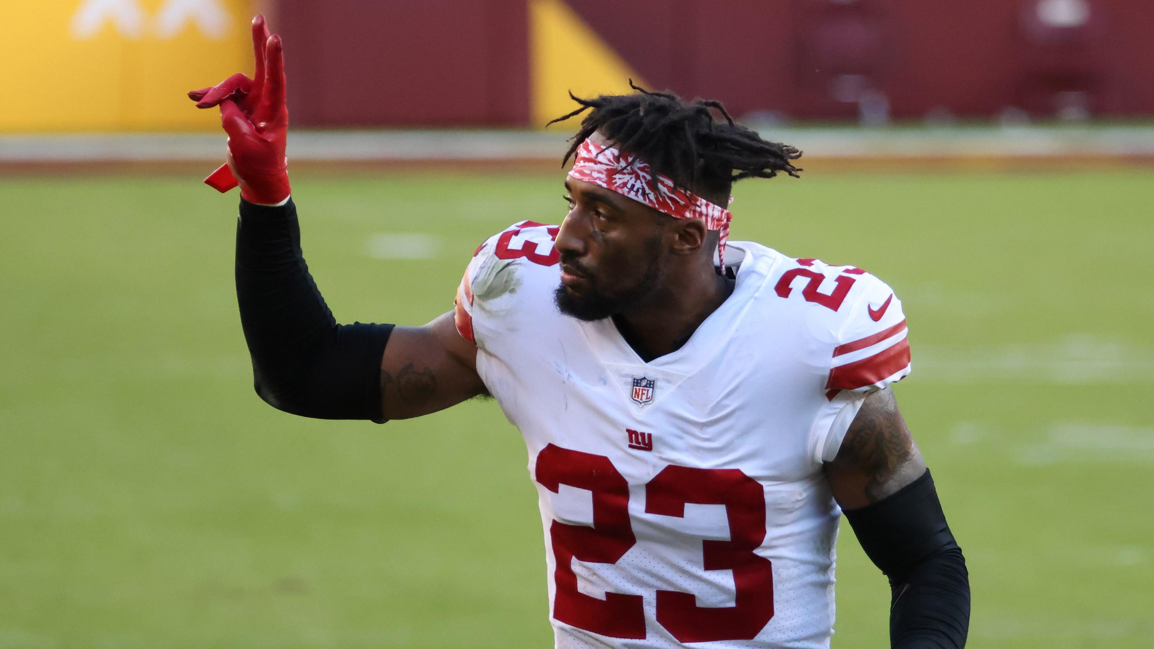 New York Giants cornerback Logan Ryan (23) waves to fans while leaving the field after the Giants' game against the Washington Football Team at FedExField.