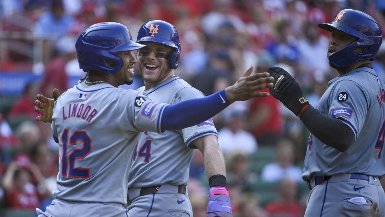 New York Mets center fielder Harrison Bader (44) shortstop Francisco Lindor (12) and catcher Francisco Alvarez (4) celebrate after scoring against the St. Louis Cardinals during the fifth inning at Busch Stadium.