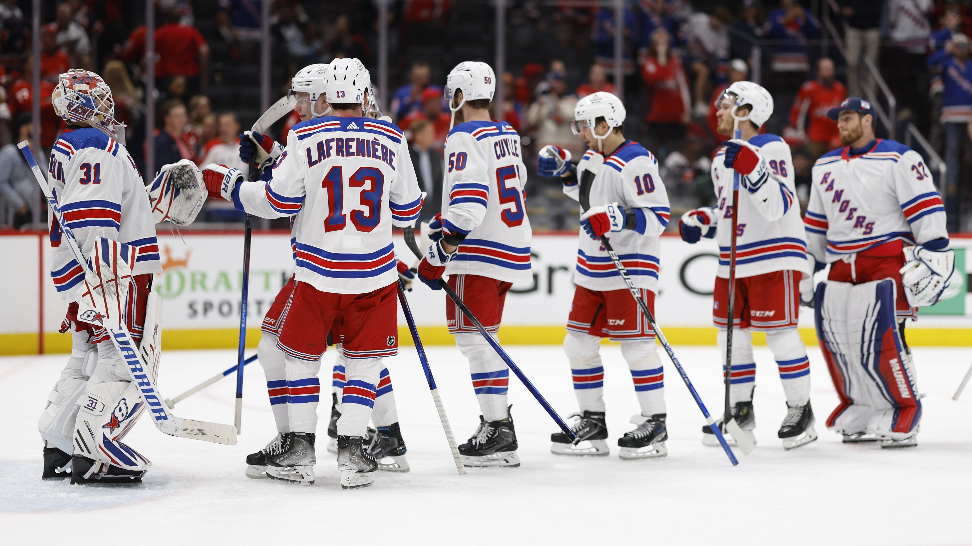 Apr 28, 2024; Washington, District of Columbia, USA; New York Rangers players celebrate after their game against the Washington Capitals in game four of the first round of the 2024 Stanley Cup Playoffs at Capital One Arena. Mandatory Credit: Geoff Burke-USA TODAY Sports