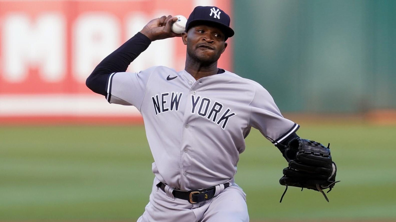 Aug 27, 2022; Oakland, California, USA; New York Yankees pitcher Domingo German (55) delivers a pitch against the Oakland Athletics in the third inning at RingCentral Coliseum.