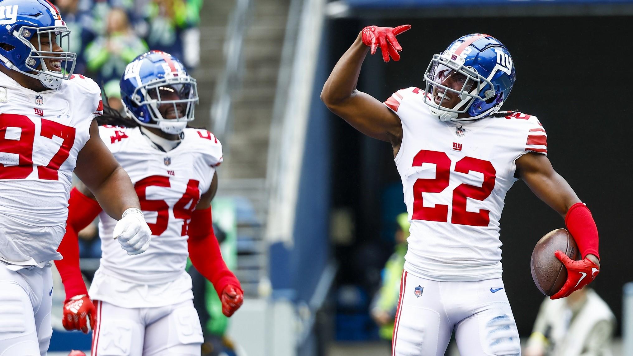 Oct 30, 2022; Seattle, Washington, USA; New York Giants cornerback Adoree Jackson (22) celebrates following a fumble recovery against the Seattle Seahawks during the second quarter at Lumen Field. New York Giants defensive tackle Dexter Lawrence (97) joins Jackson at left.