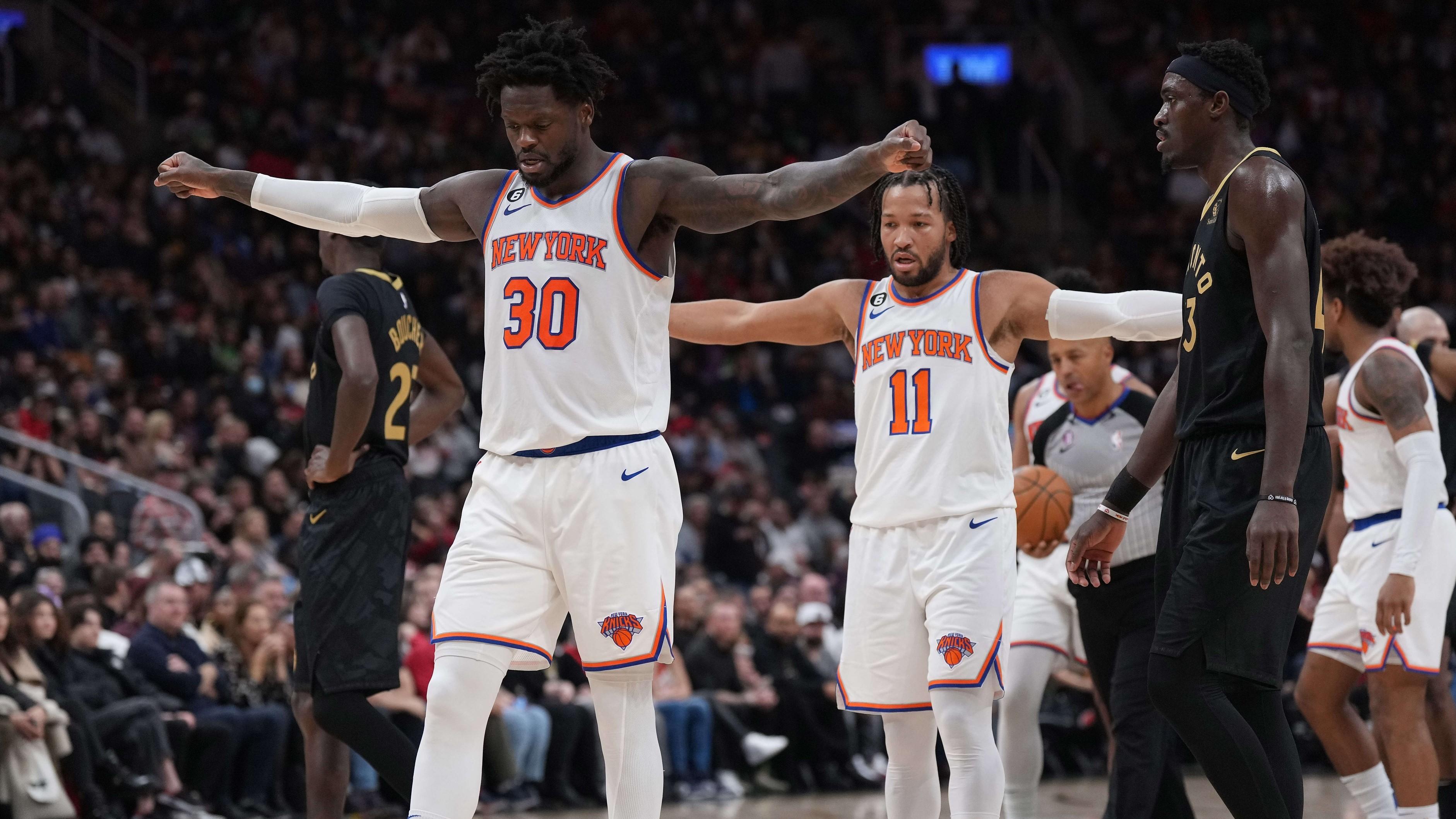 Jan 6, 2023; Toronto, Ontario, CAN; New York Knicks forward Julius Randle (30) and New York Knicks guard Jalen Brunson (11) react against the Toronto Raptors during the second quarter at Scotiabank Arena.