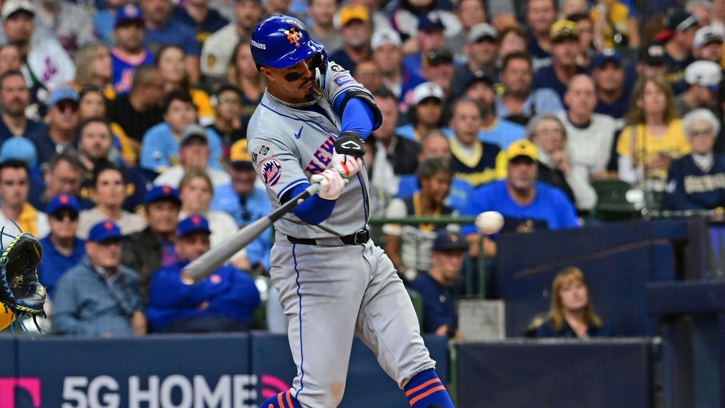 New York Mets third base Mark Vientos (27) hits a single against the Milwaukee Brewers during the second inning in game one of the Wildcard round for the 2024 MLB Playoffs at American Family Field.