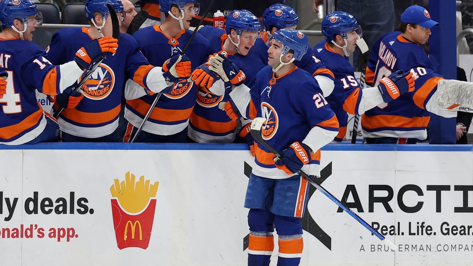 New York Islanders center Kyle Palmieri (21) celebrates his natural hat trick against the Boston Bruins with teammates during the first quarter at UBS Arena.