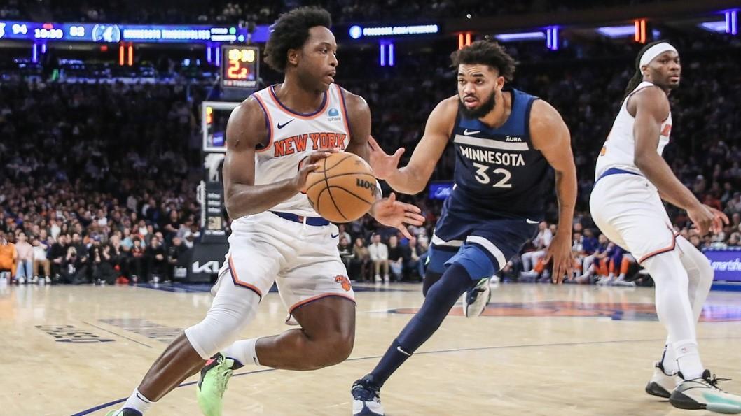 Jan 1, 2024; New York, New York, USA; New York Knicks forward OG Anunoby (8) looks to drive past Minnesota Timberwolves center Karl-Anthony Towns (32) in the fourth quarter at Madison Square Garden. 