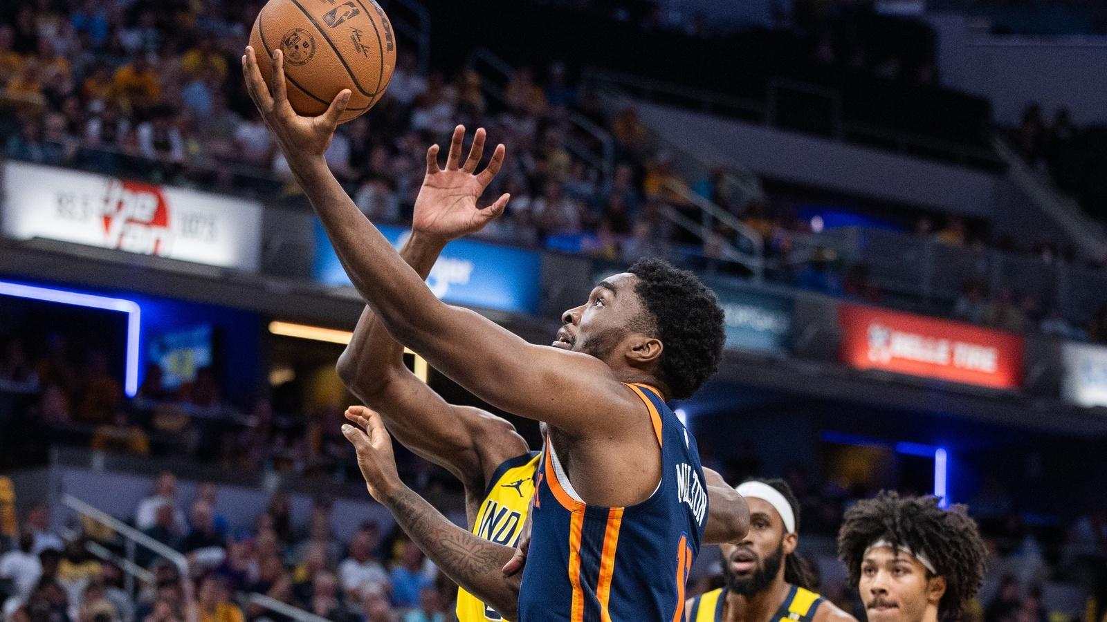 New York Knicks guard Shake Milton (13) shoots the ball while Indiana Pacers forward Jalen Smith (25) defends during game four of the second round for the 2024 NBA playoffs at Gainbridge Fieldhouse.