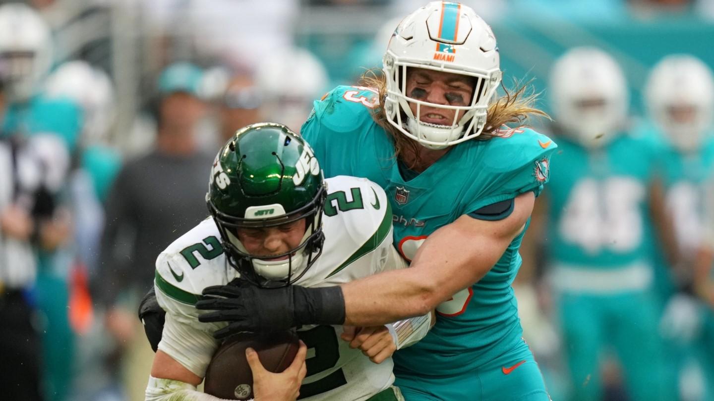 Dec 19, 2021; Miami Gardens, Florida, USA; Miami Dolphins inside linebacker Andrew Van Ginkel (43) sacks New York Jets quarterback Zach Wilson (2) during the second half at Hard Rock Stadium.