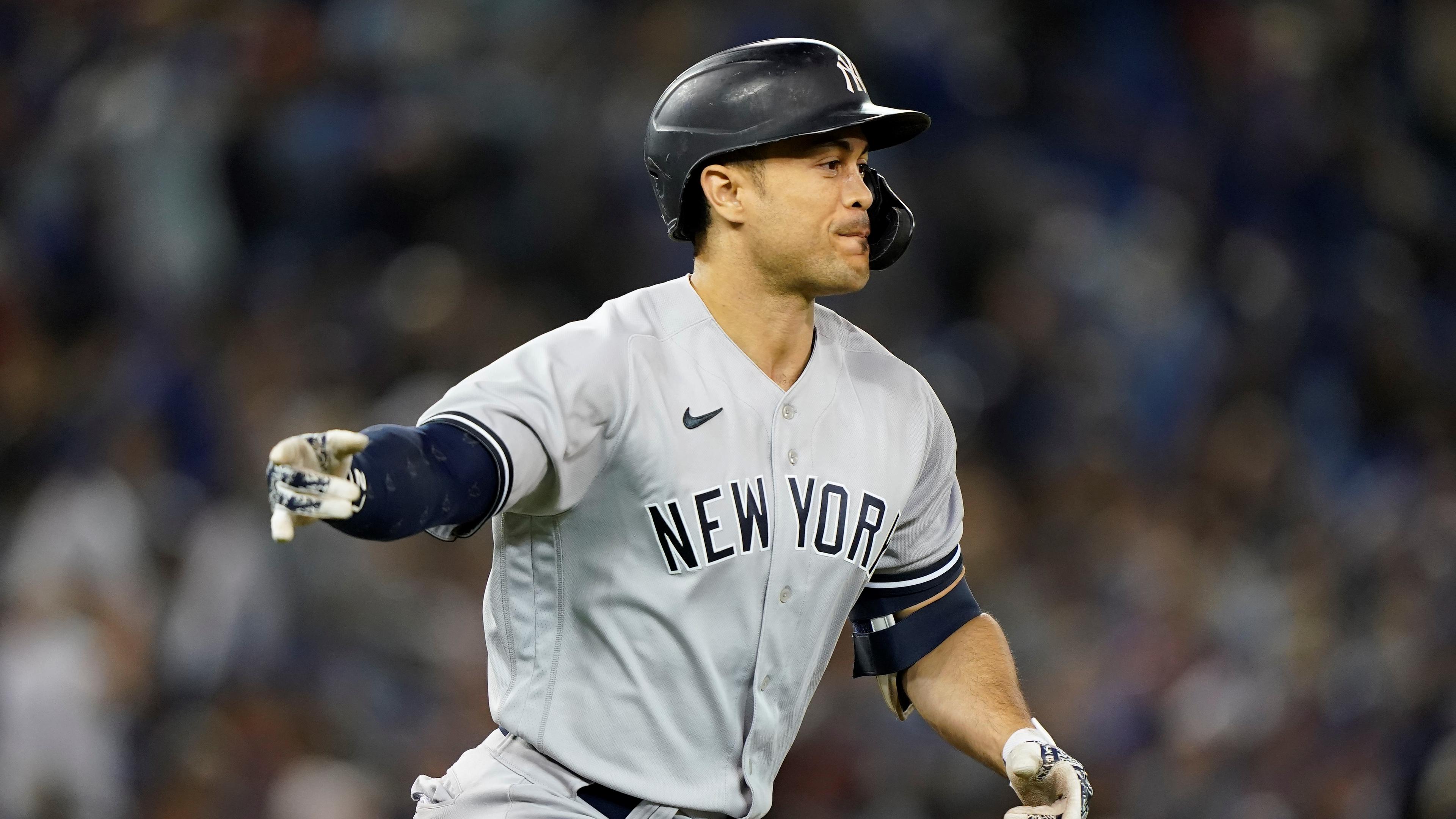 Sep 28, 2021; Toronto, Ontario, CAN; New York Yankees designated hitter Giancarlo Stanton (27) gestures to his bench after hitting a three run home run against the Toronto Blue Jays during the seventh inning at Rogers Centre. Mandatory Credit: John E. Sokolowski-USA TODAY Sports