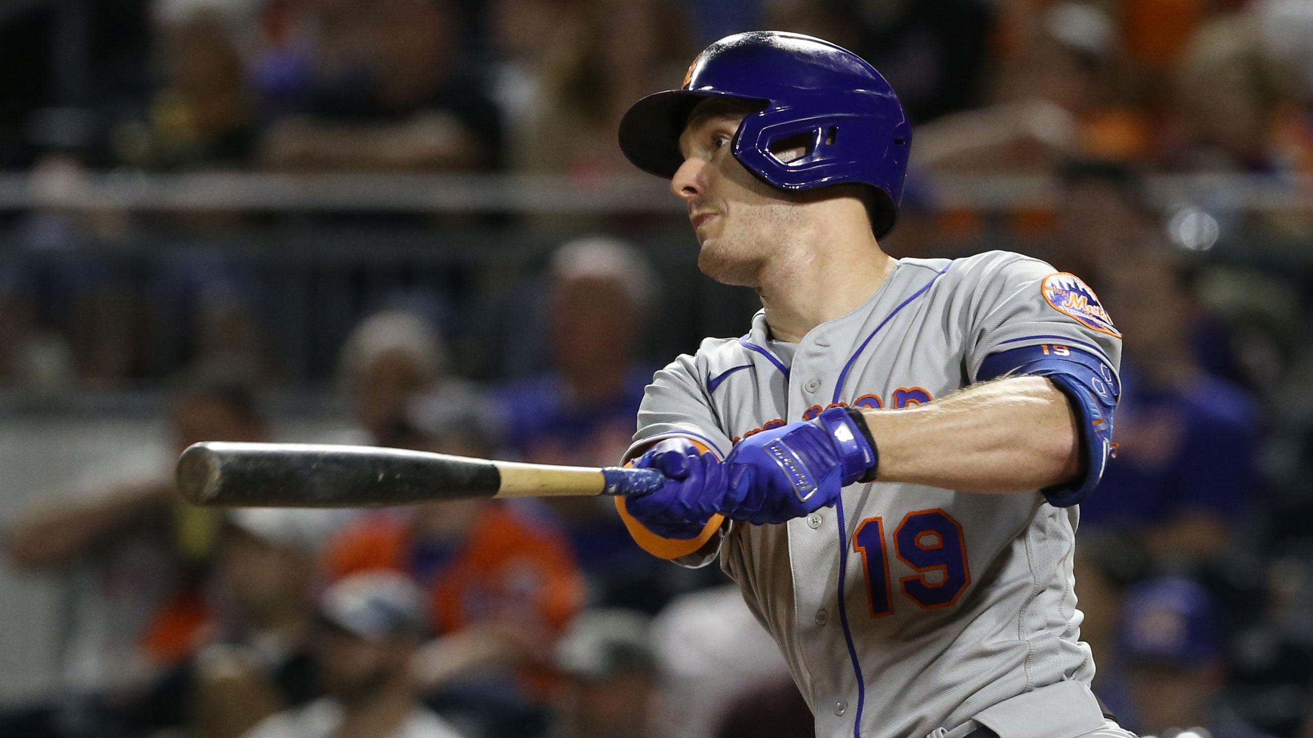 Sep 7, 2022; Pittsburgh, Pennsylvania, USA; New York Mets left fielder Mark Canha (19) hits a double against the Pittsburgh Pirates during the seventh inning at PNC Park.