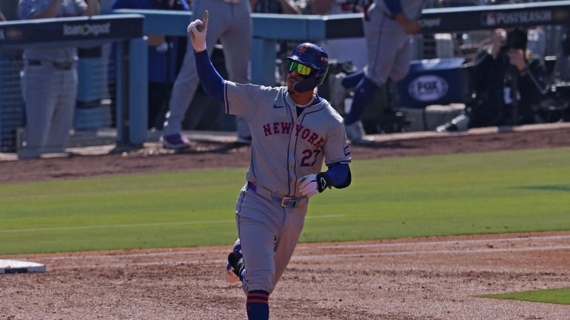 New York Mets third base Mark Vientos (27) reacts after hitting a grand slam against Los Angeles Dodgers pitcher Landon Knack (not pictured) in the second inning during game two of the NLCS for the 2024 MLB Playoffs at Dodger Stadium.