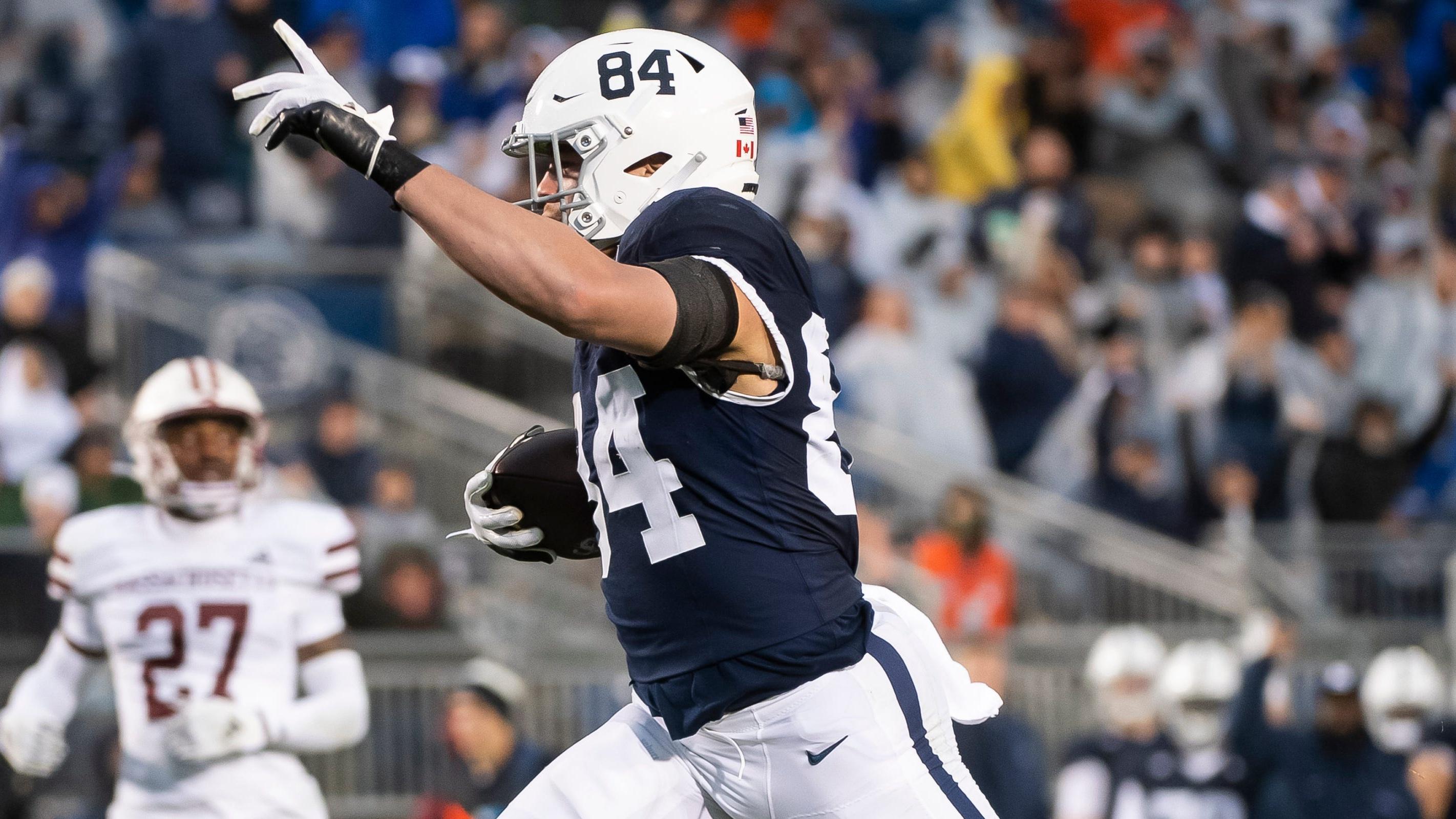 Penn State tight end Theo Johnson (84) celebrates as he scores a 30-yard receiving touchdown during the second half of a NCAA football game against Massachusetts