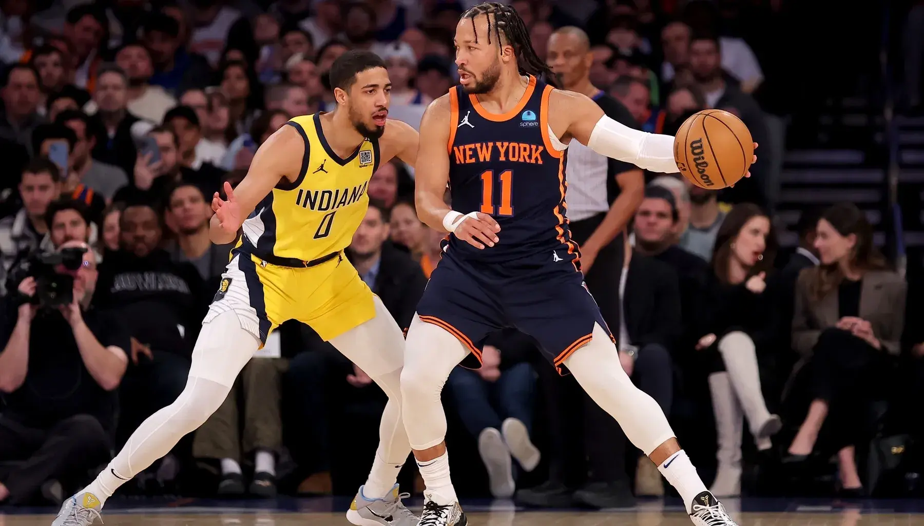 New York Knicks guard Jalen Brunson (11) controls the ball against Indiana Pacers guard Tyrese Haliburton (0) during the first quarter at Madison Square Garden. / Brad Penner-USA TODAY Sports