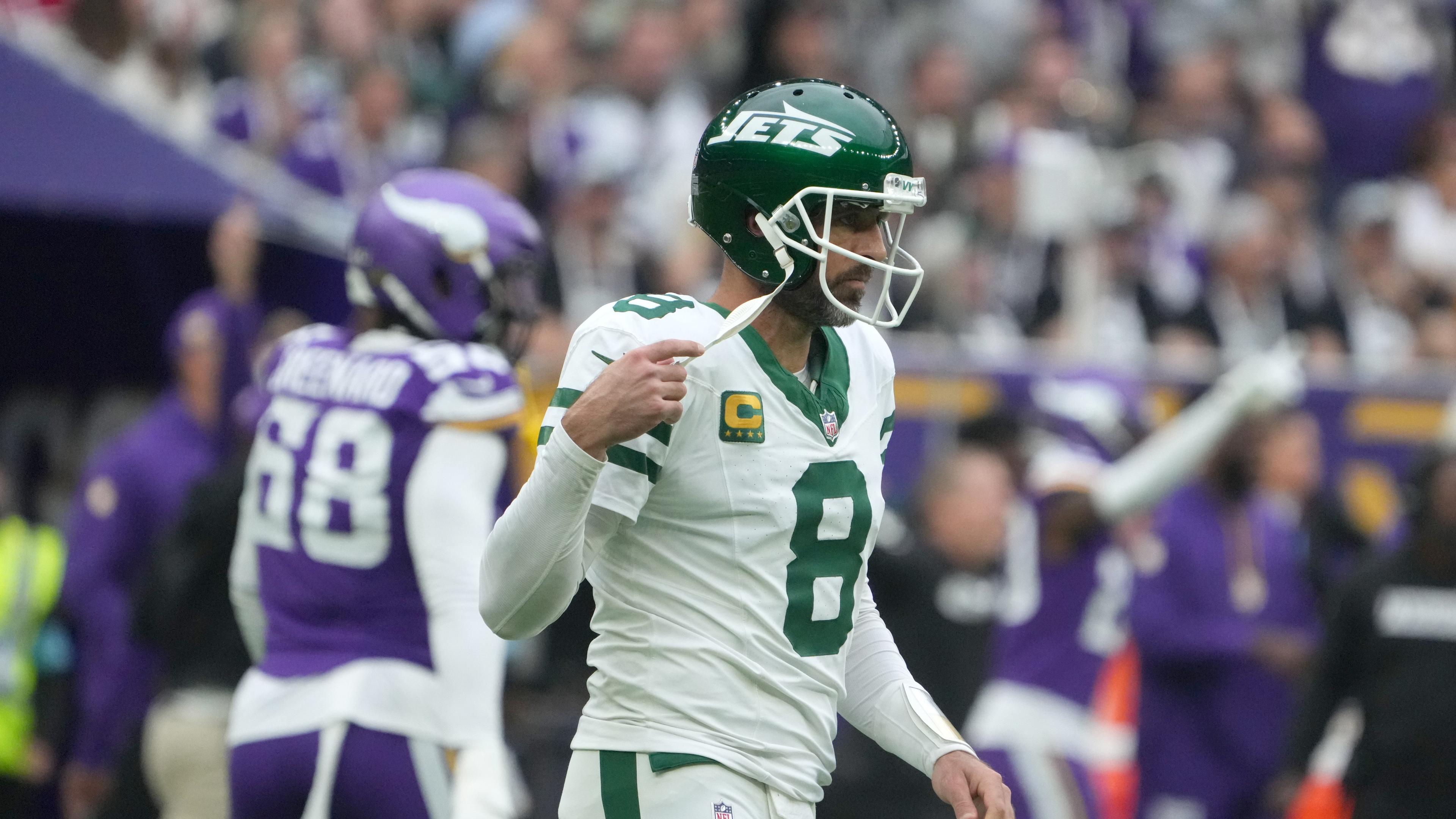 Oct 6, 2024; London, United Kingdom; New York Jets quarterback Aaron Rodgers (8) reacts after throwing an interception against the Minnesota Vikings in the first half at Tottenham Hotspur Stadium. Mandatory Credit: Kirby Lee-Imagn Images