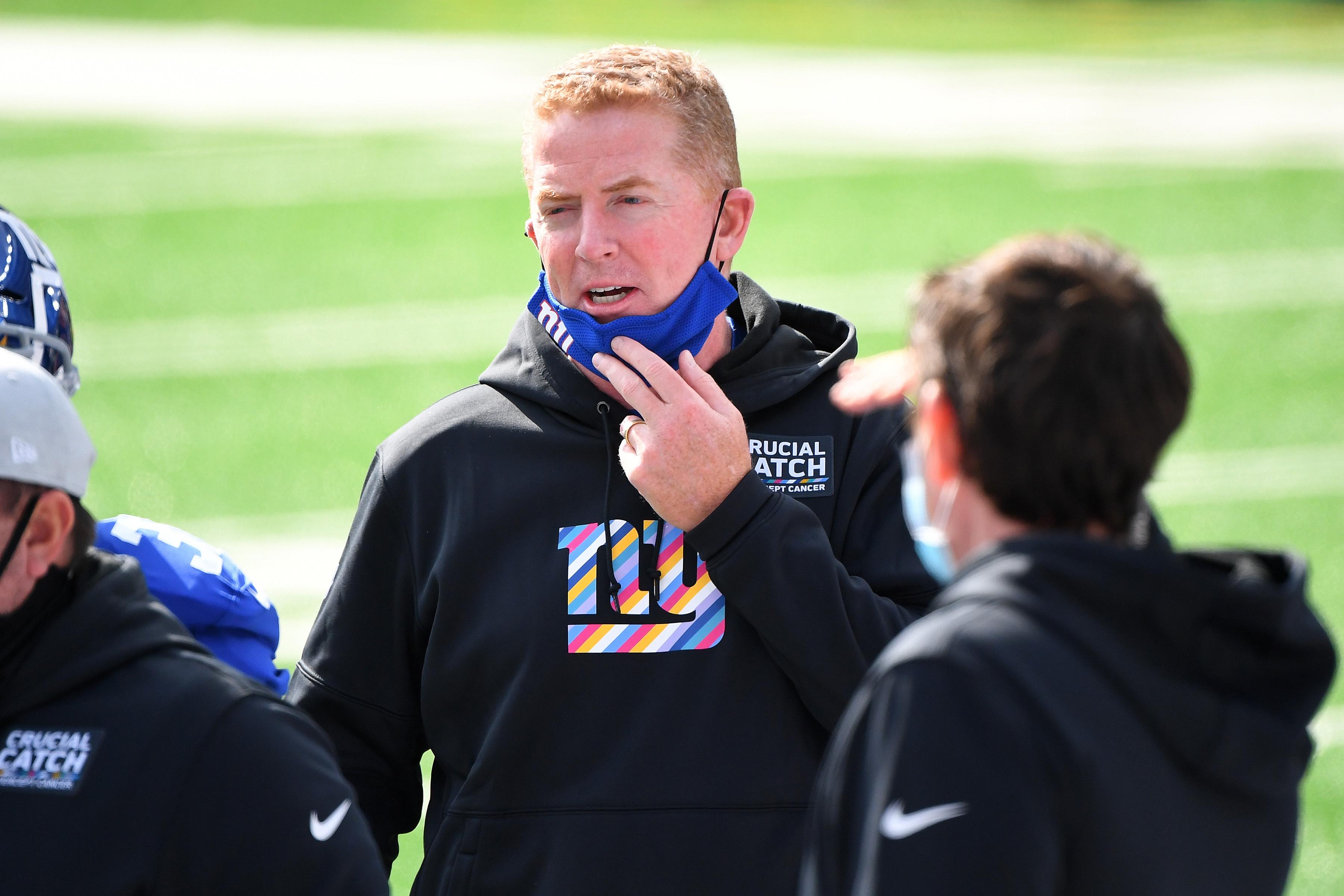 Oct 18, 2020; East Rutherford, New Jersey, USA; The New York Giants offensive coordinator Jason Garrett talks with his players prior to their game against the Washington Football Team at MetLife Stadium.